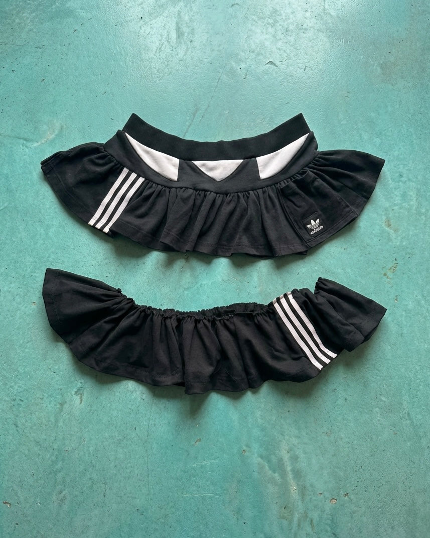 Mono Adidas hoodie and layered skirt.