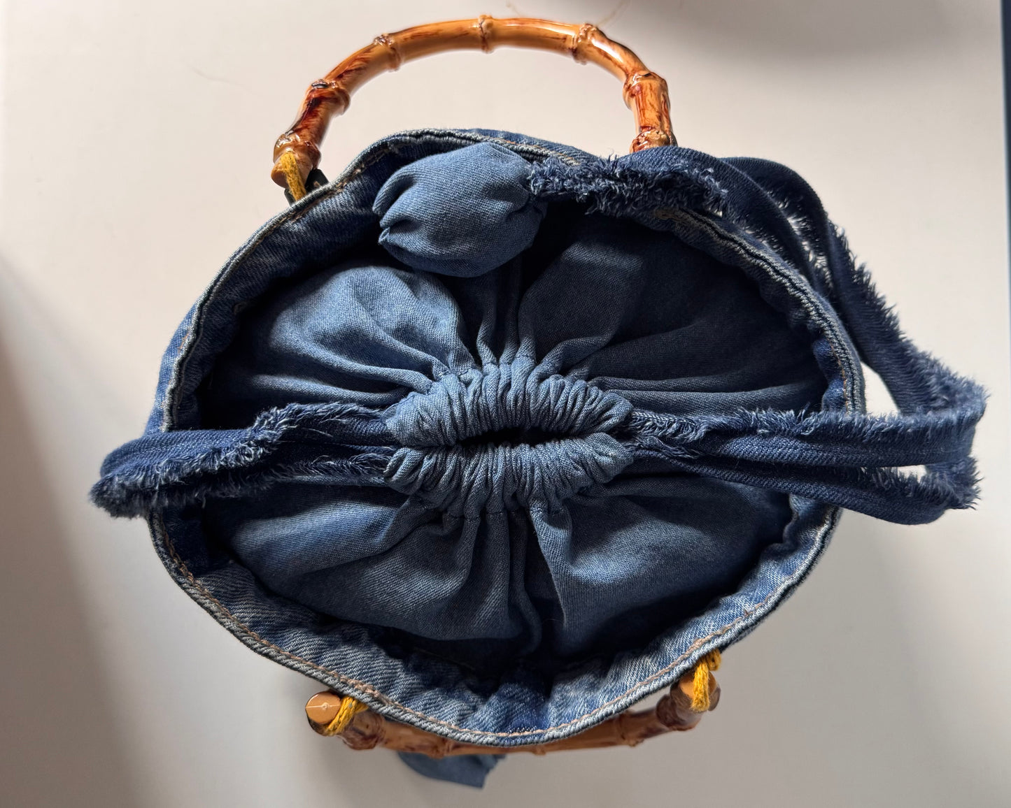Quilted tote bag with Bamboo cane curved handles and drawstring