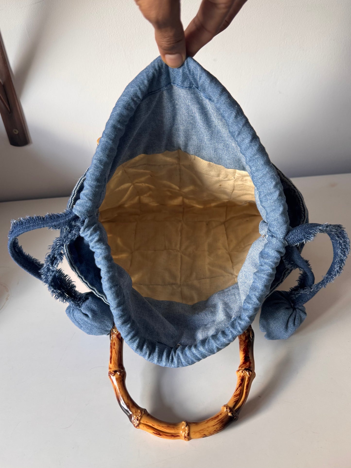 Quilted tote bag with Bamboo cane curved handles and drawstring