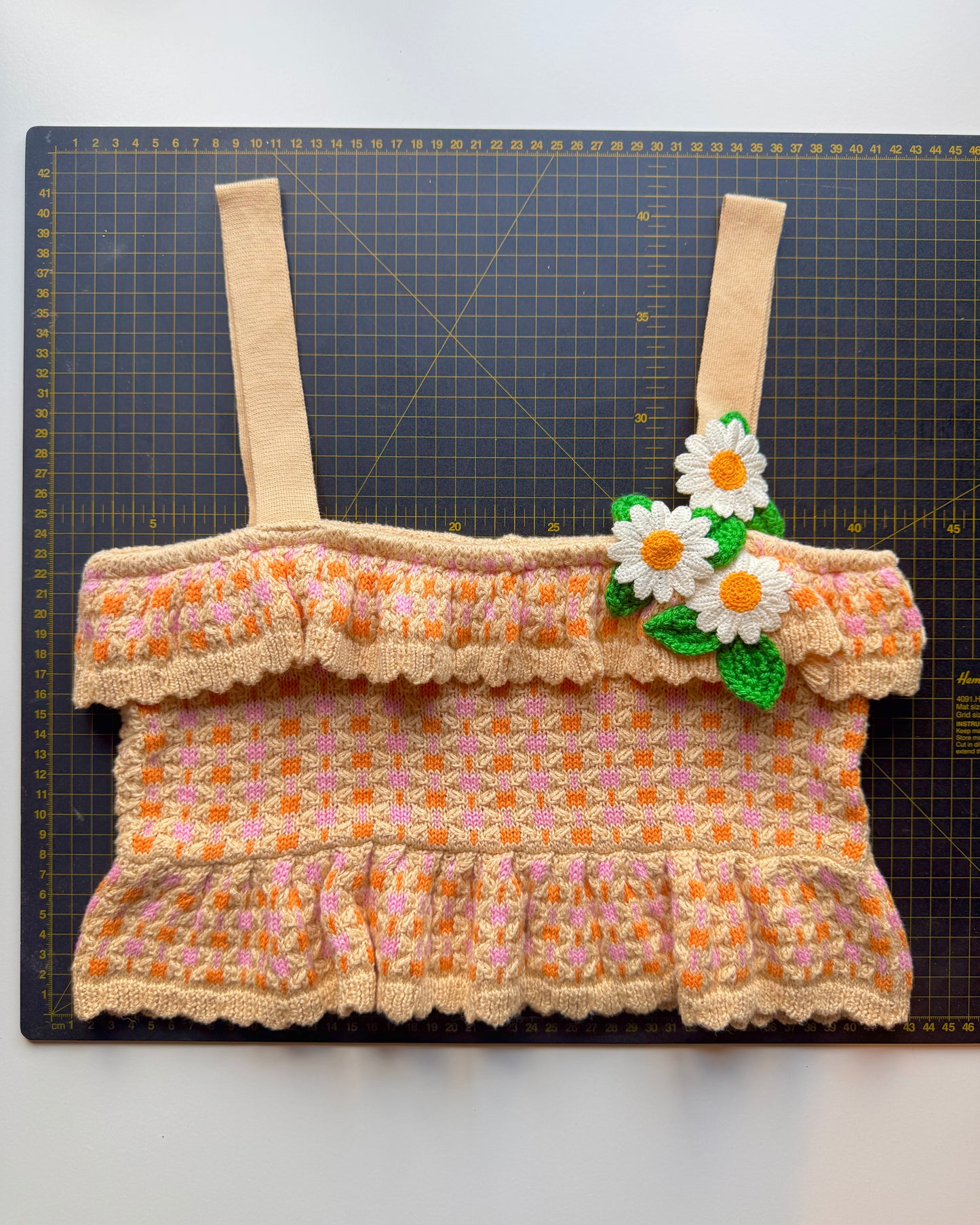 Knitted frill hem cropped square neck top with daisy crochet flower