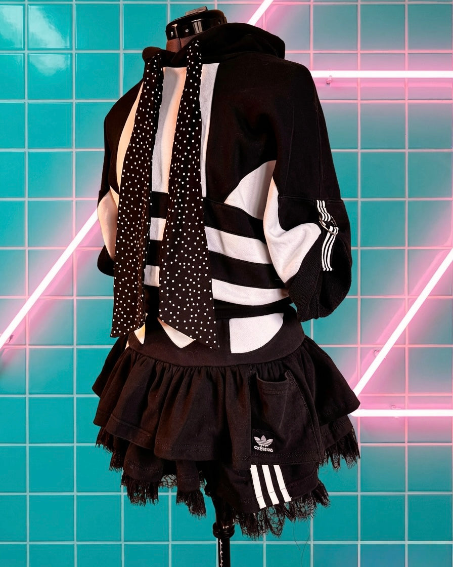 Mono Adidas hoodie and layered skirt.