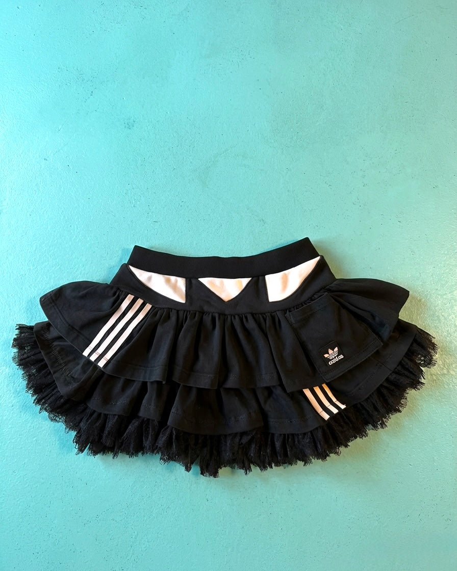 Mono Adidas hoodie and layered skirt.