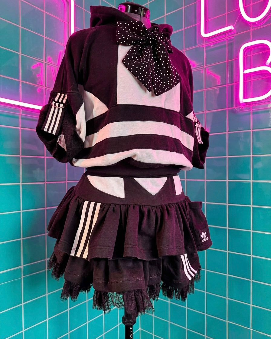 Mono Adidas hoodie and layered skirt.