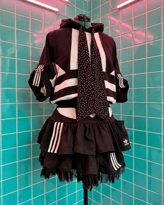 Mono Adidas hoodie and layered skirt.