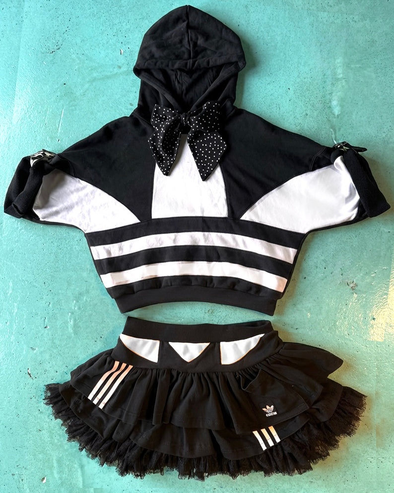 Mono Adidas hoodie and layered skirt.