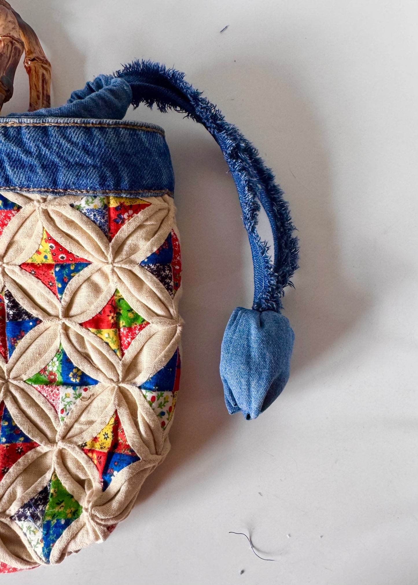 Quilted tote bag with Bamboo cane curved handles and drawstring