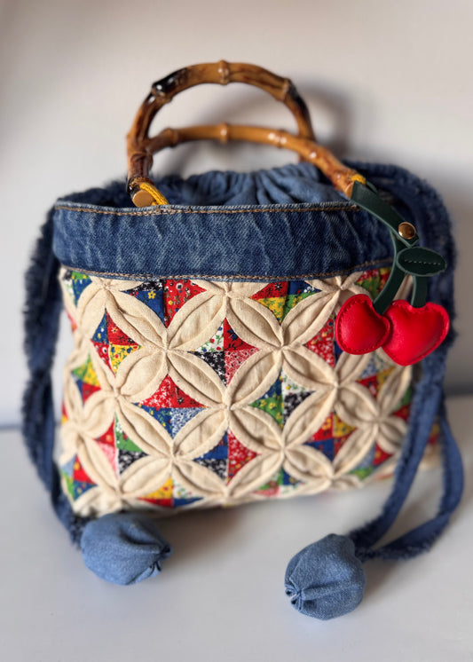 Quilted tote bag with Bamboo cane curved handles and drawstring