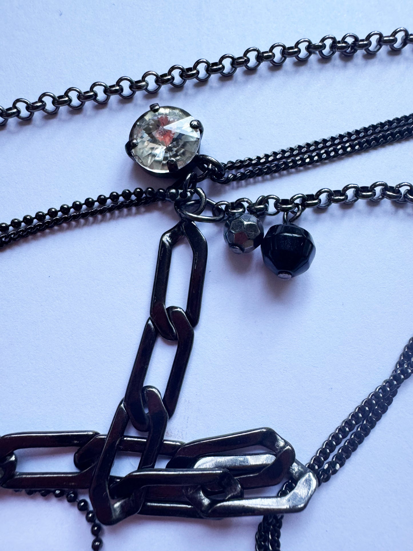 Black multi chain drop necklace with gems