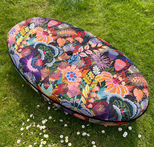 Parker Knoll footstool in Mars Meadow velvet by studio Coverdale