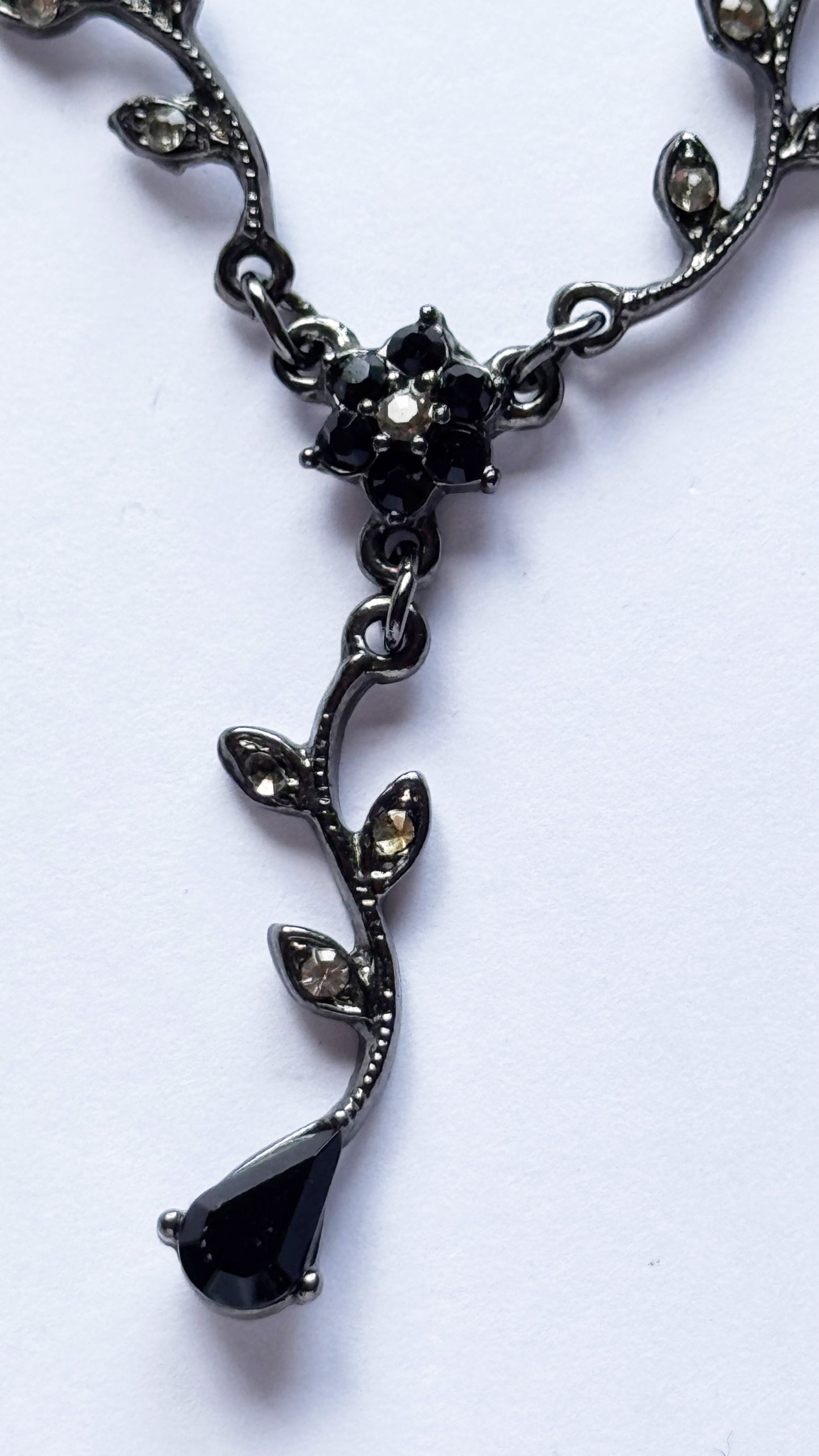 Black multi chain drop necklace with gems