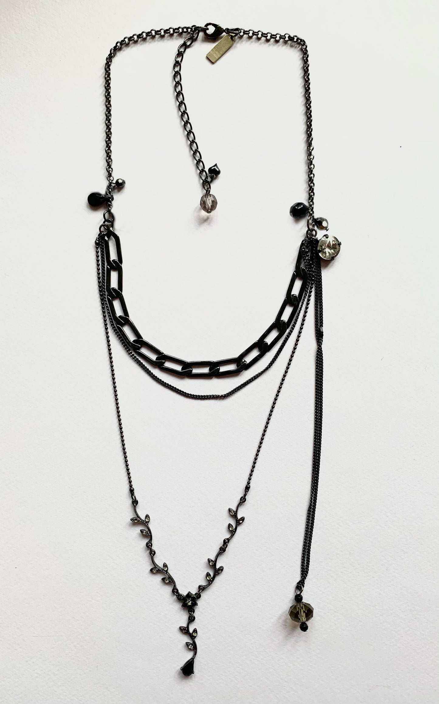 Black multi chain drop necklace with gems