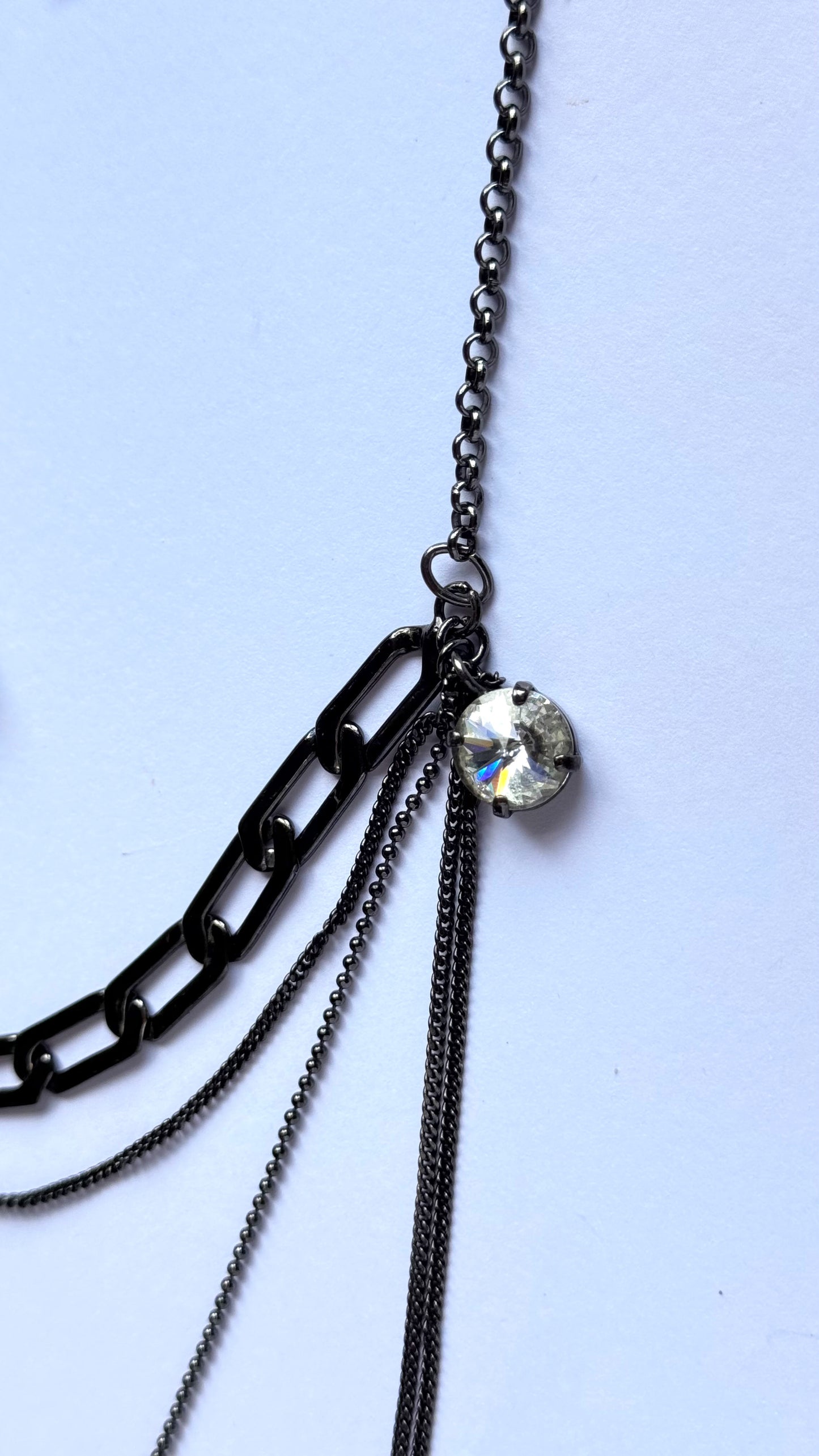 Black multi chain drop necklace with gems