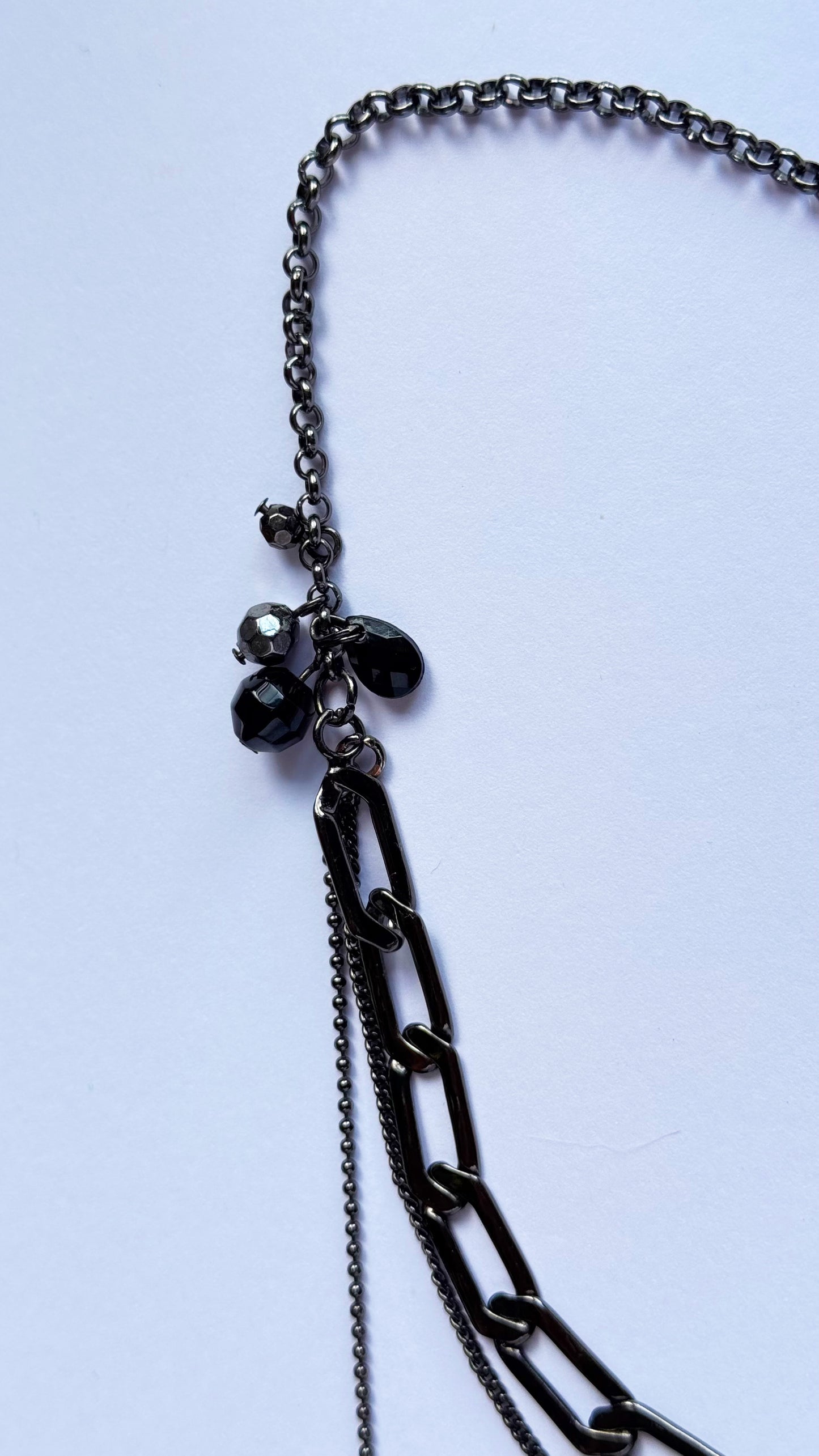 Black multi chain drop necklace with gems