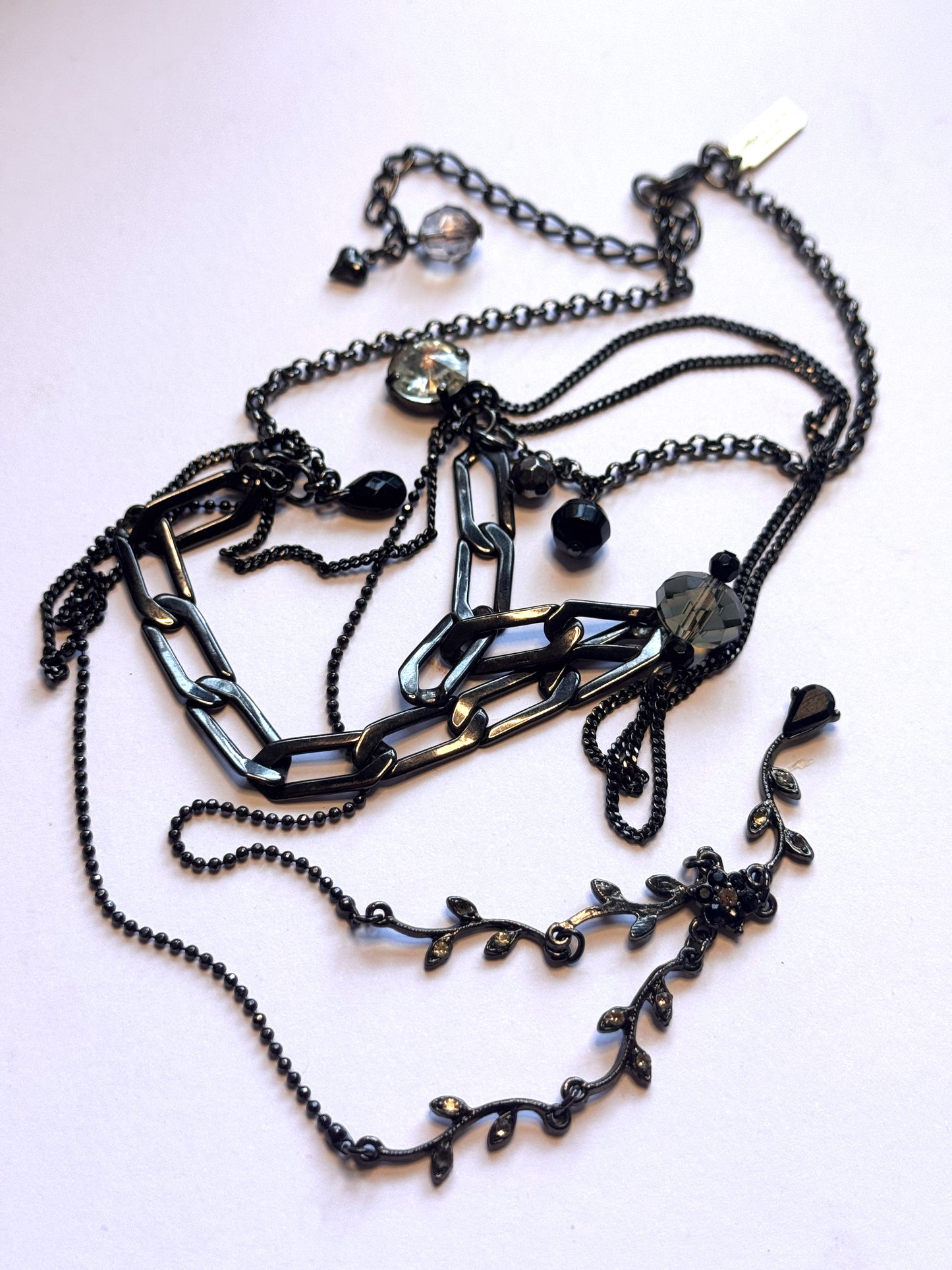 Black multi chain drop necklace with gems